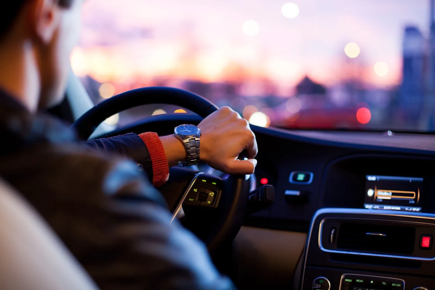 Smartphone showing DiDi ride-hailing app with a car arriving in China