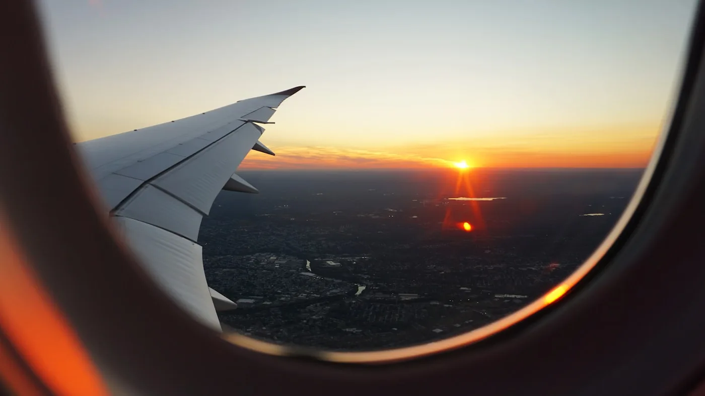 Airplane window view at sunrise on a flight toward China